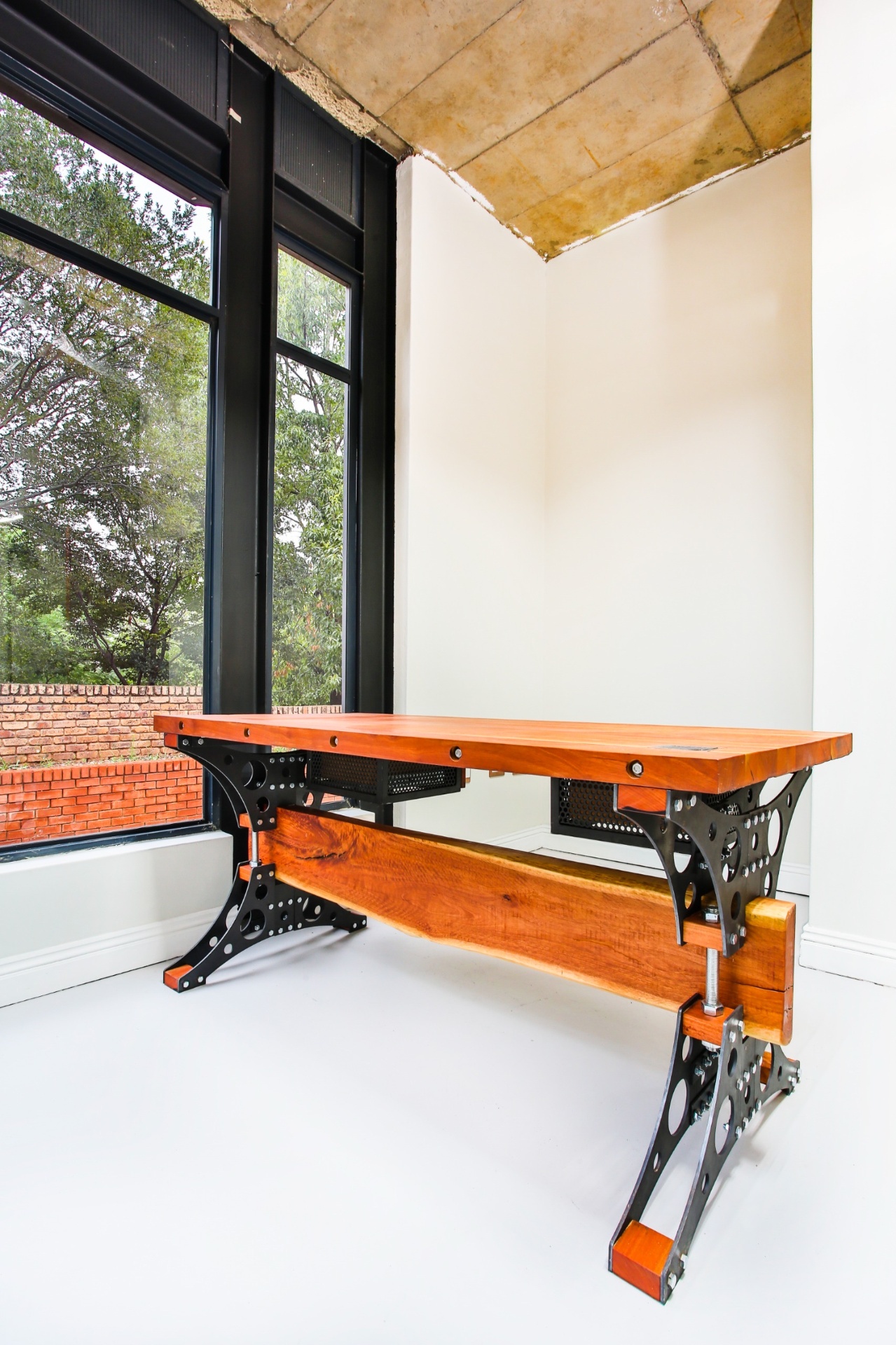 Bespoke executive desk with solid hardwood top and laser-cut steel legs, handcrafted by Brandt Möbel Kreatif in Stanford